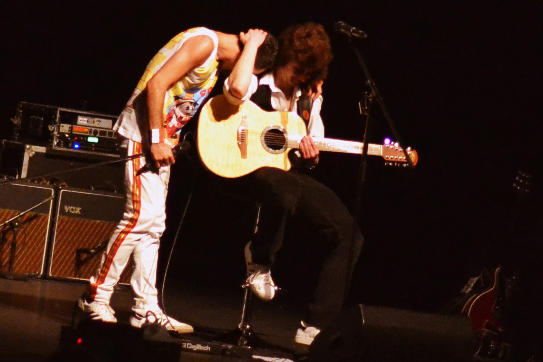 Flash Queen tribute Freddie Mercury and Brian May acoustic moment on stage
