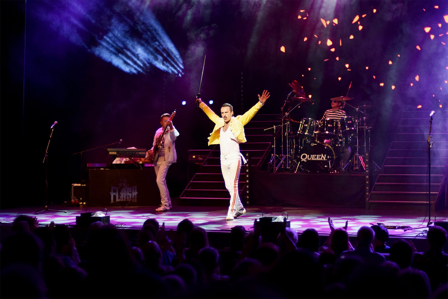 Flash Queen tribute live on stage with Freddie Mercury performer and crowd